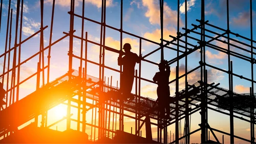 Workers at sunset, representing state workforce development in transportation and clean energy